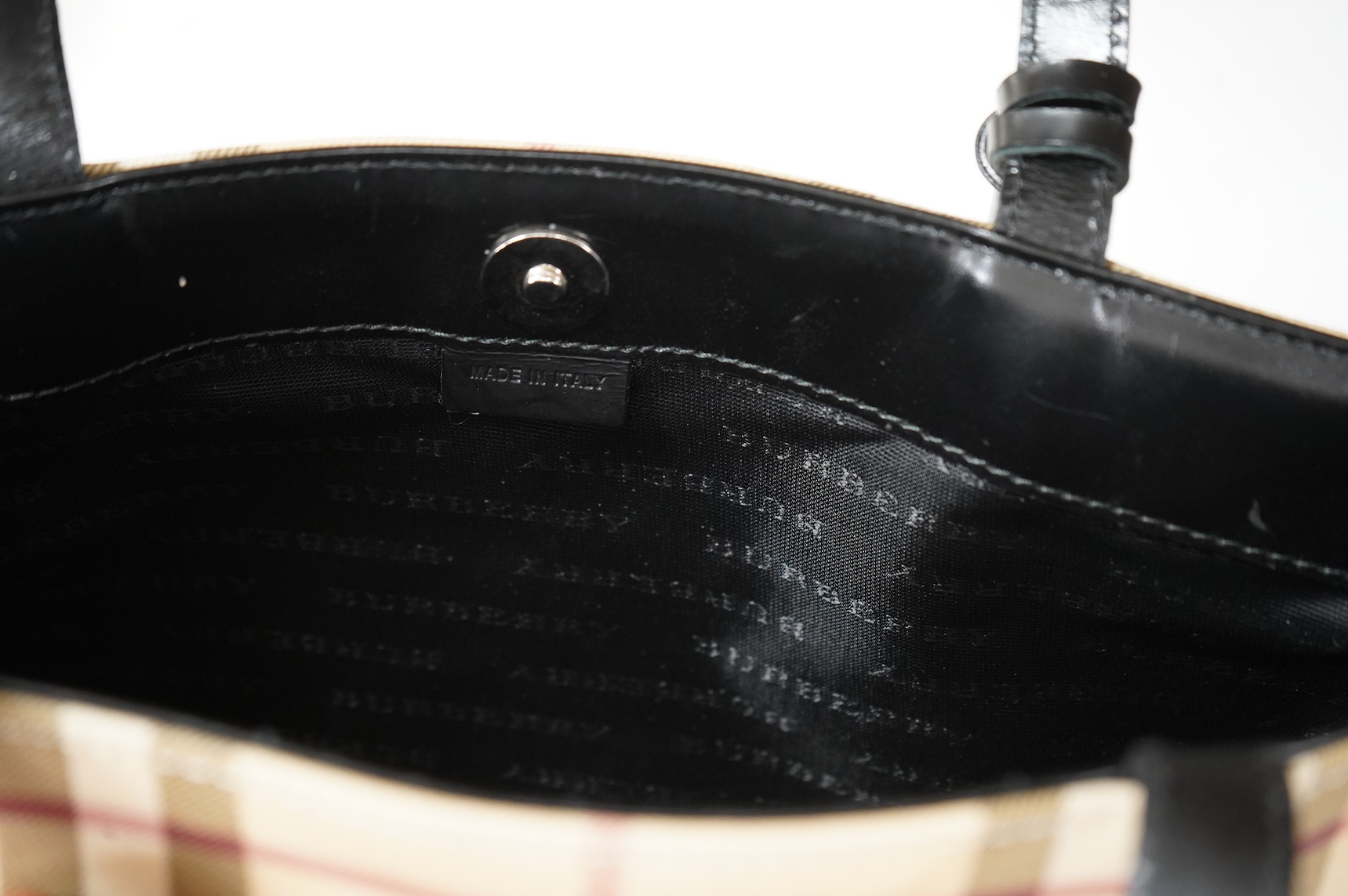 A Burberry handbag with PCV check exterior, 28cm wide